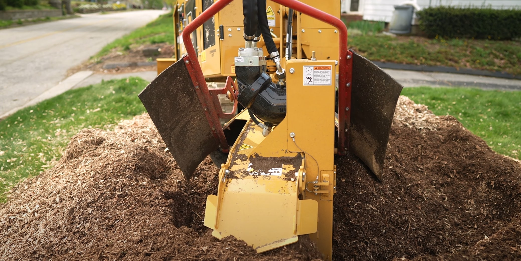 Professional stump grinding equipment in action removing tree stump in Missouri, TX